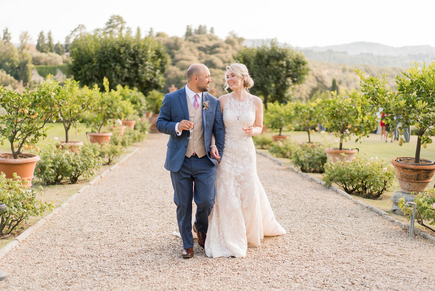 bride and groom walking at medicea di lilliano in tuscany