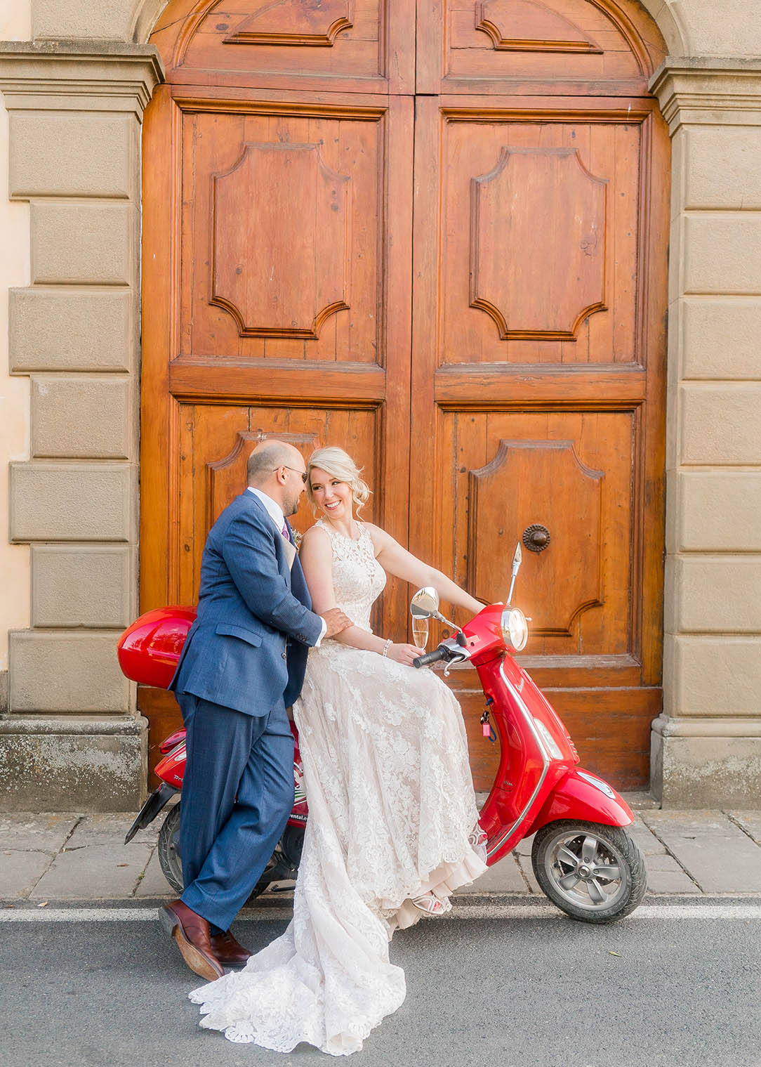 bride and groom portrait on a vespa in tuscany italy